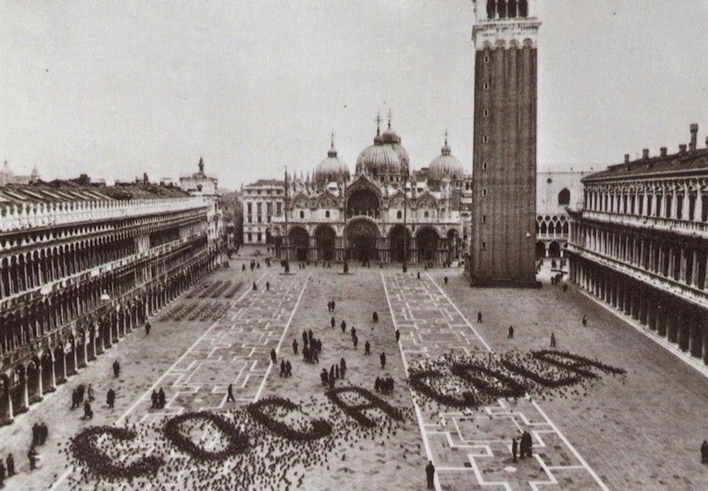 A Coca Cola advertisement made by spreading grains for pigeons in Saint Mark's Square, Venice, 1960